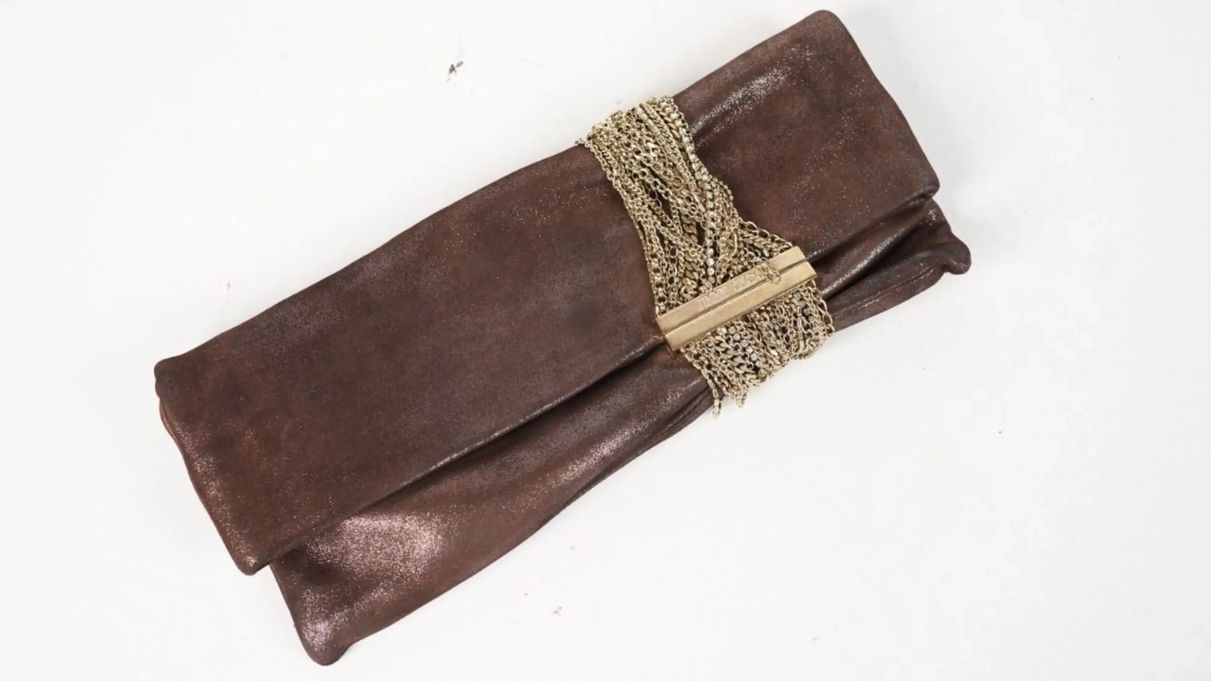 Before Jimmy Choo clutch restoration faded metallic surface with uneven tone