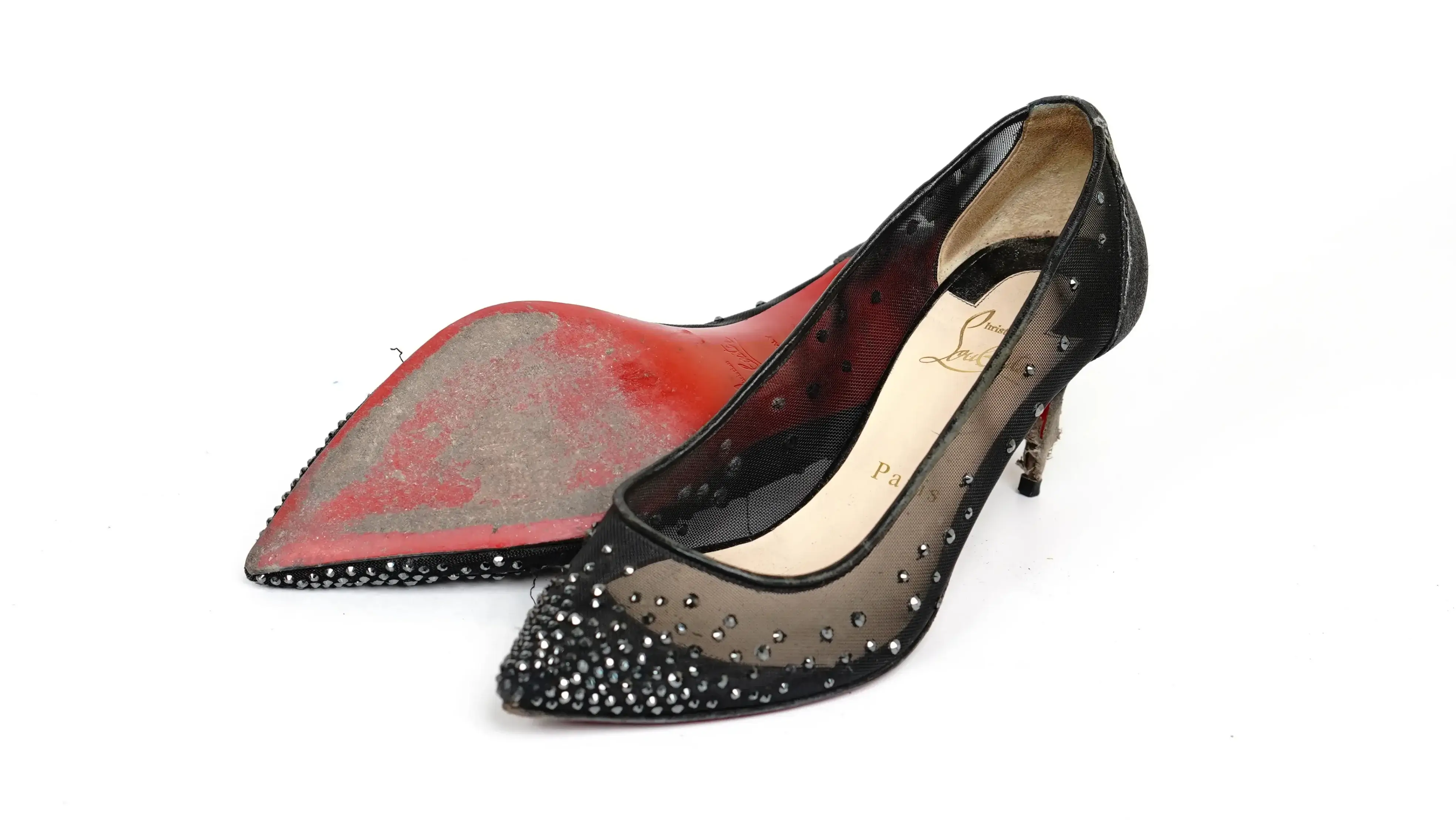 After Louboutin red sole colour restoration showing revived glossy red finish