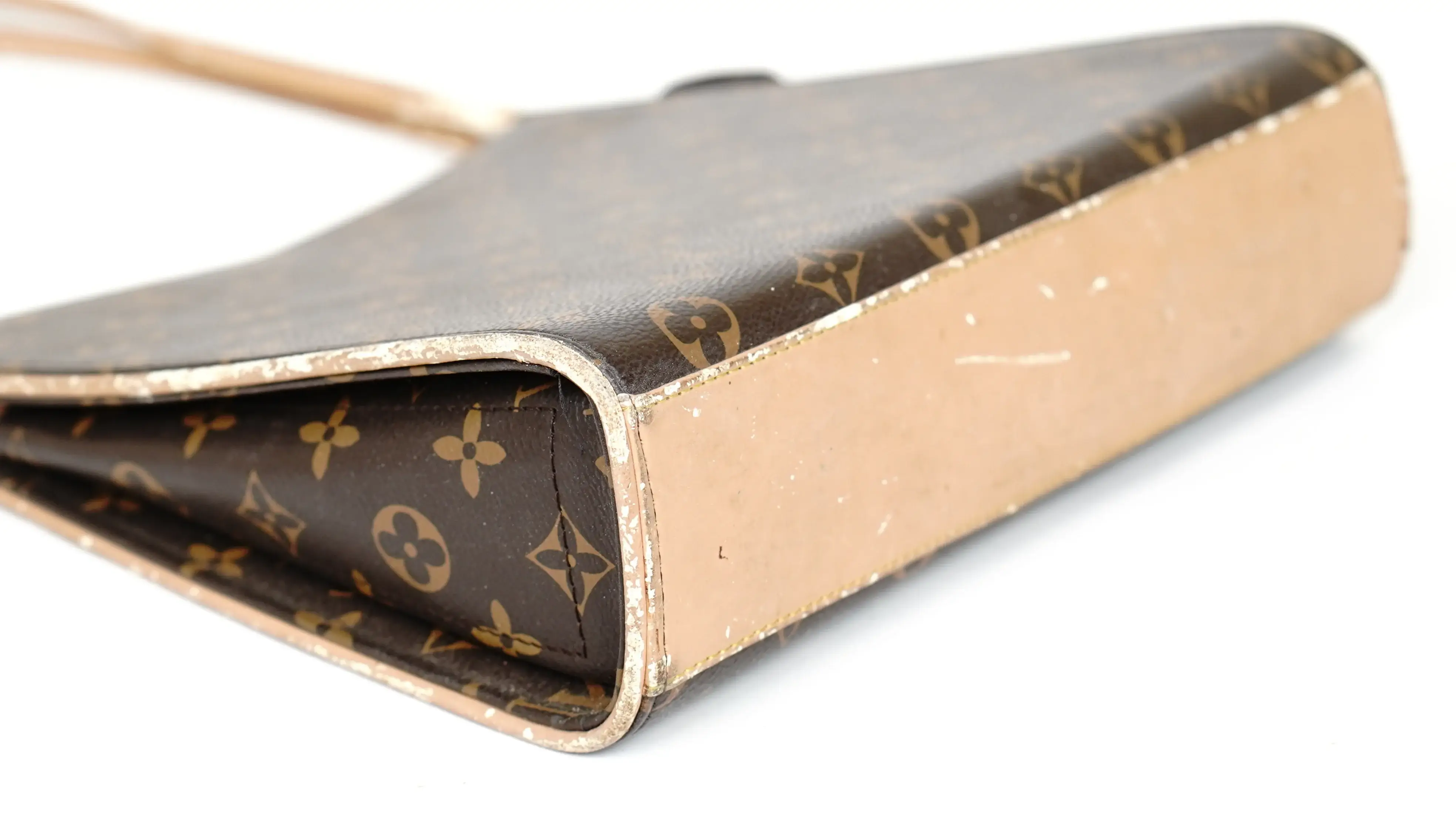 After Louis Vuitton handbag restoration new leather panel seamlessly matched and colour fully revived