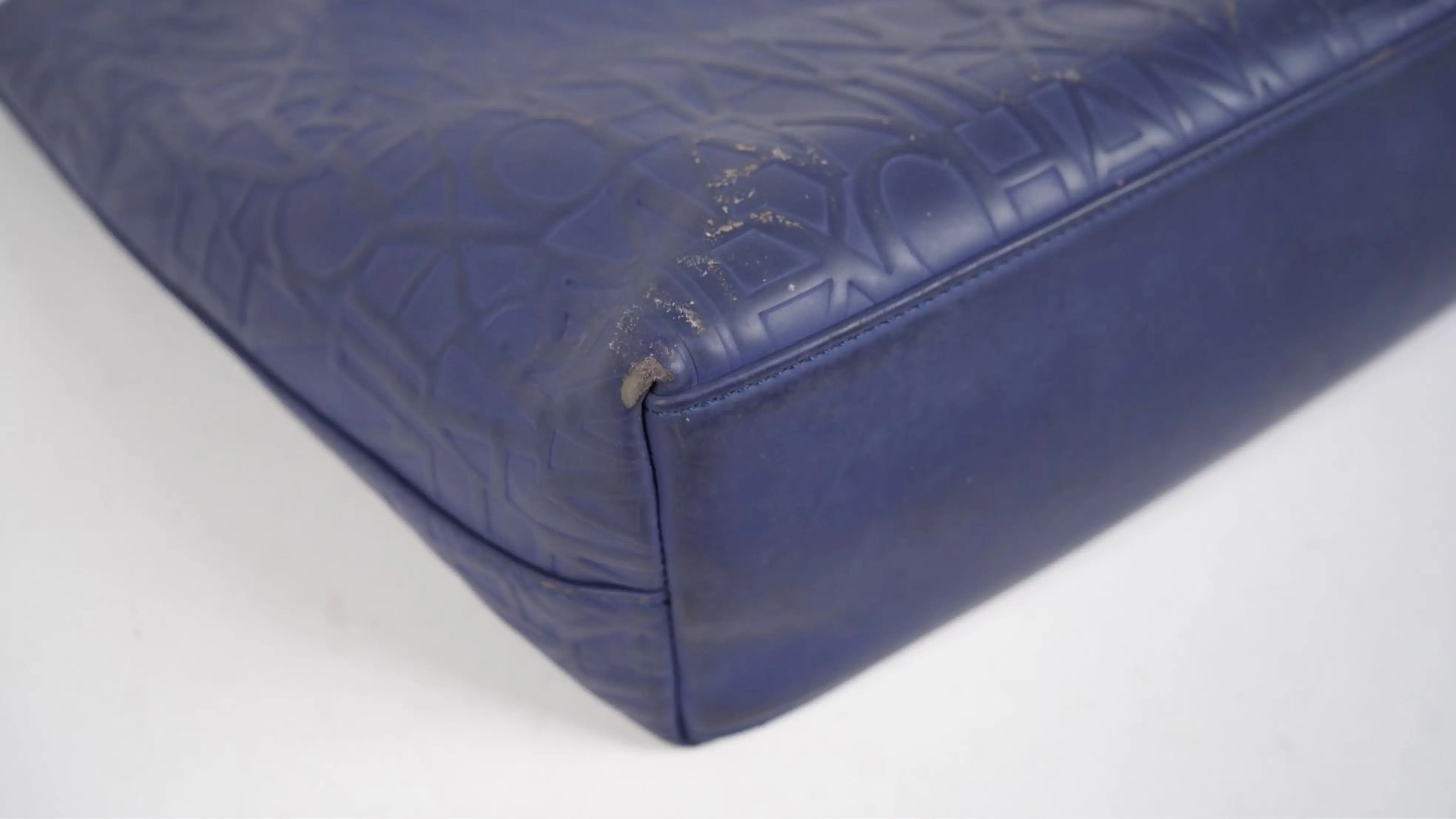 After Armani Exchange bag restoration reinforced base edges with smooth, renewed finish