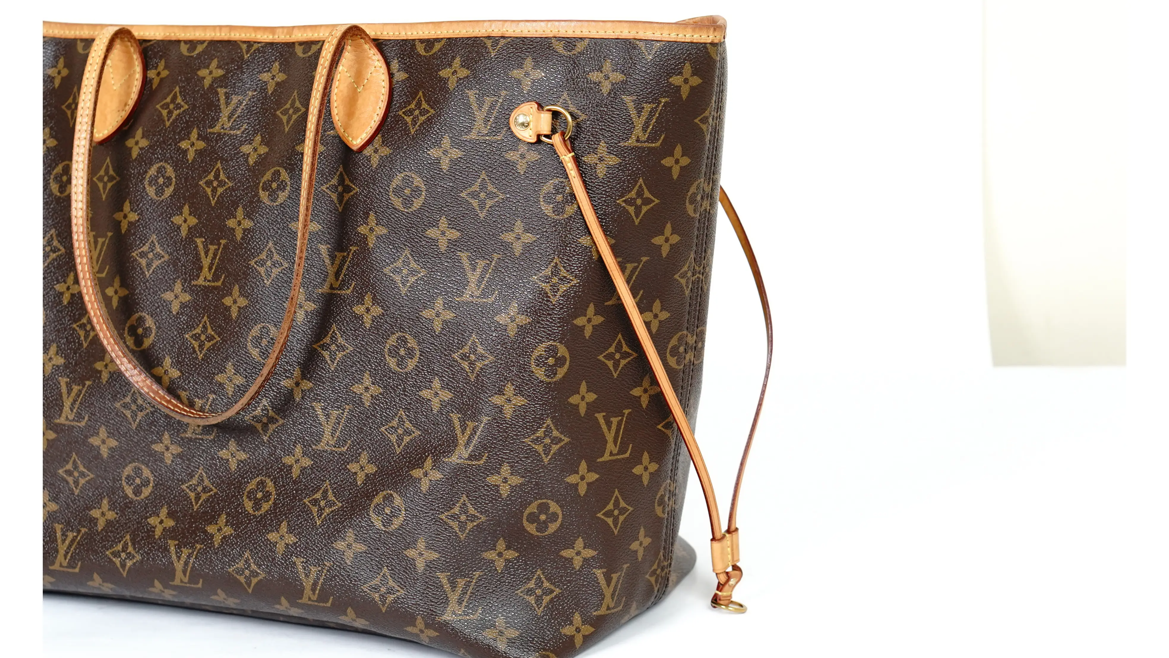 Before Louis Vuitton tote restoration broken side strings with frayed edges