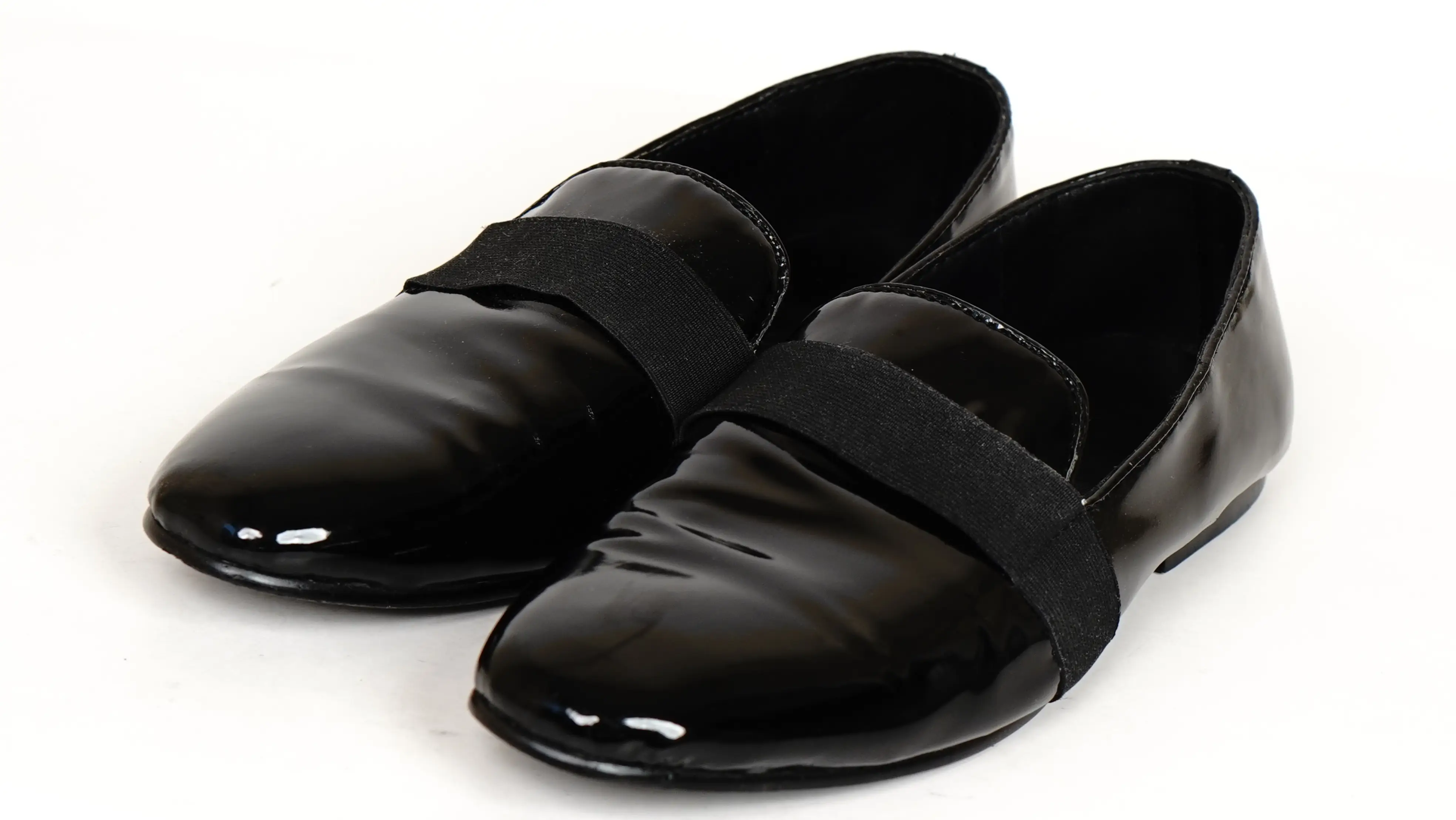 Before Gucci footwear restoration dull patent surface with visible scuffs and loss of shine